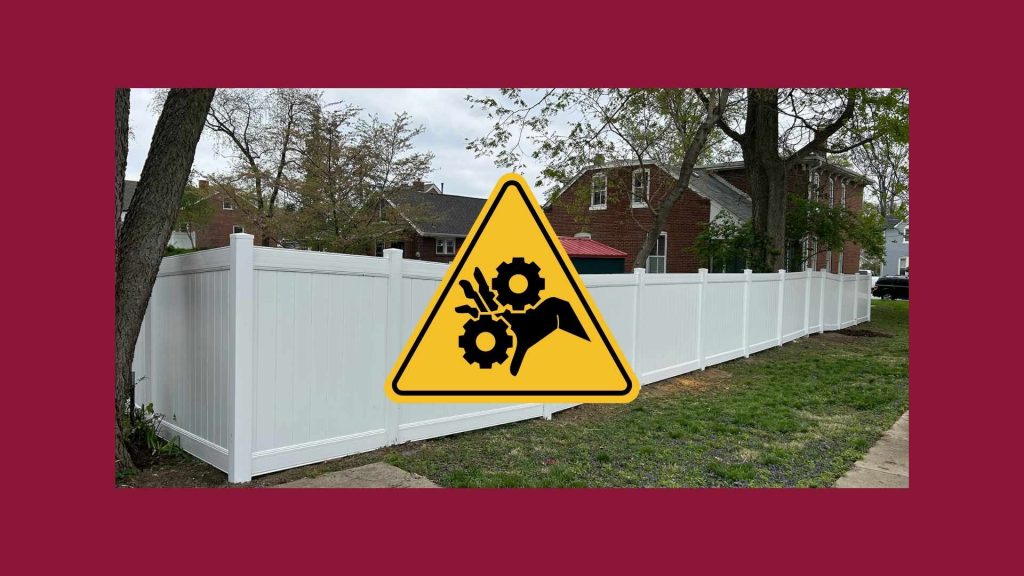 Technician cleaning and repairing white vinyl fence panels in St. Louis for Sexton Fence